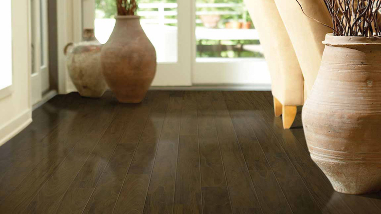 dark wood look laminate flooring in a stylish dining room